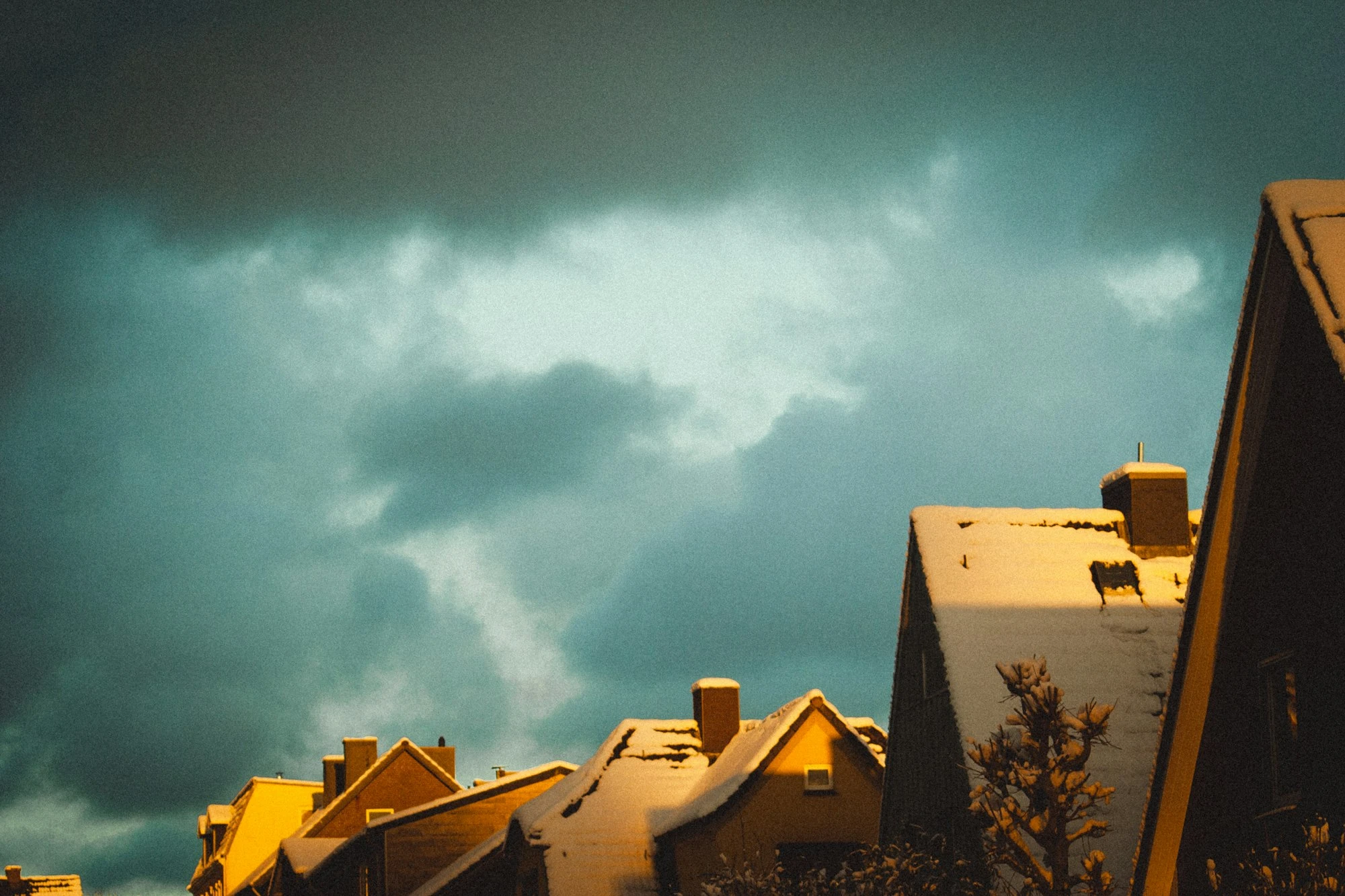 Alabama homes beneath storm clouds